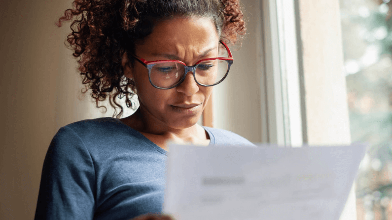 A woman reading the foreclosure process