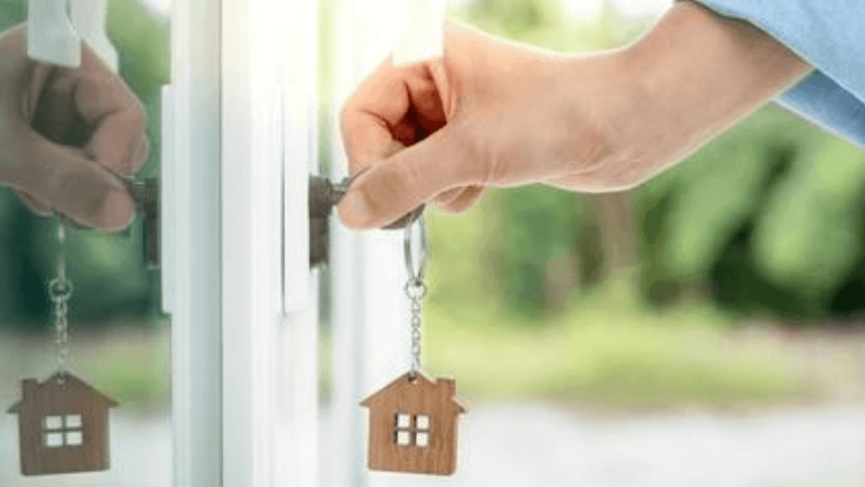 A man unlocking a door