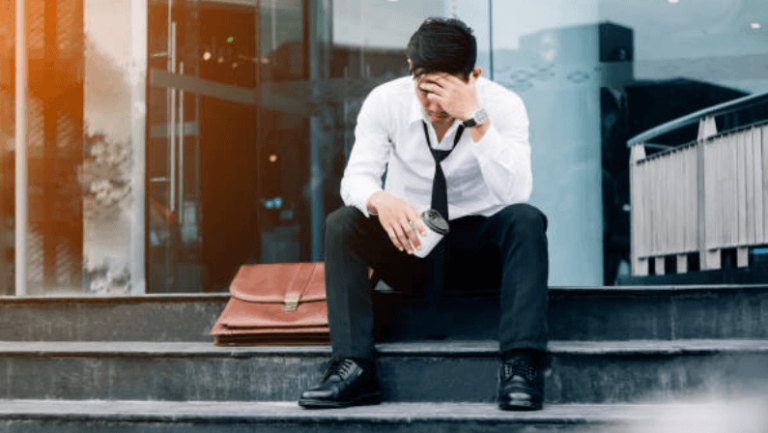 a man who is worrying about his mortgage after losing his job