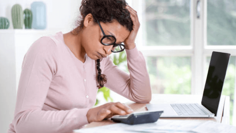 a woman that is shock and got problems on her mortgage payments