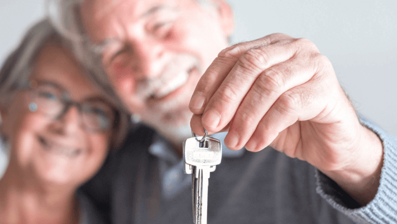 Lovely couple holding a key 