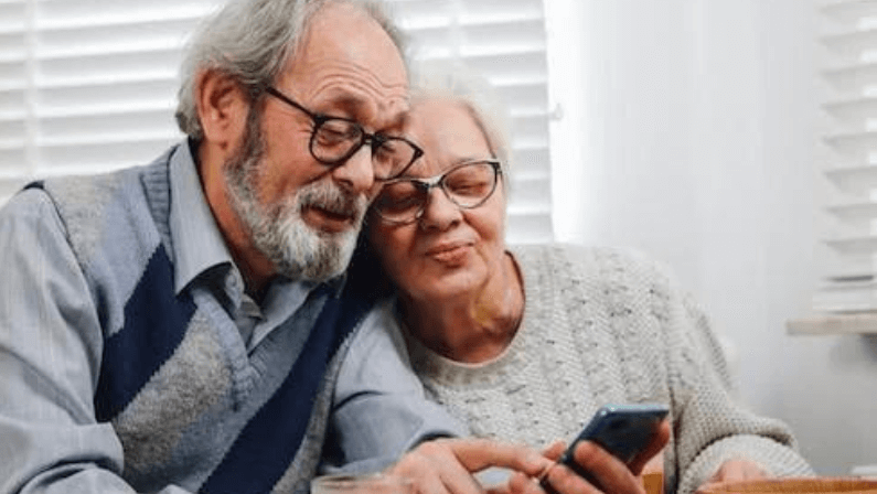 A couple checking their benefits