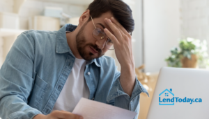 Canadian homeowner reviewing mortgage application after a decline
