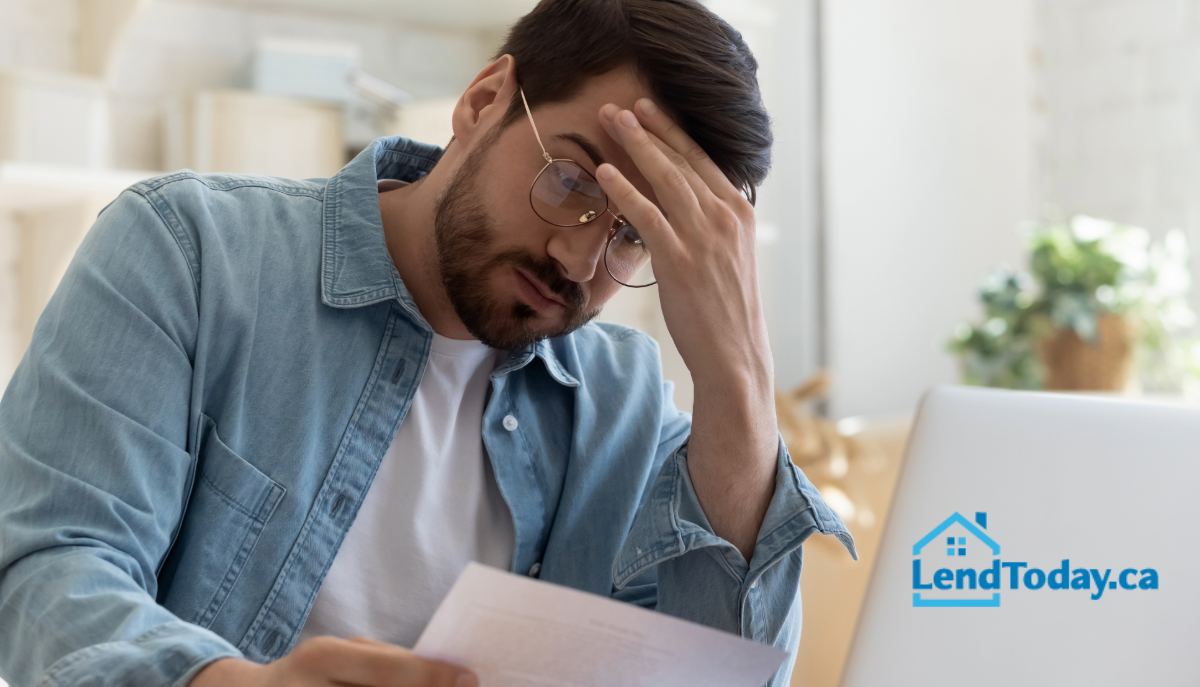 Canadian homeowner reviewing mortgage application after a decline