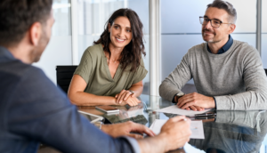 Mortgage broker discussing loan options with a first-time homebuyer.