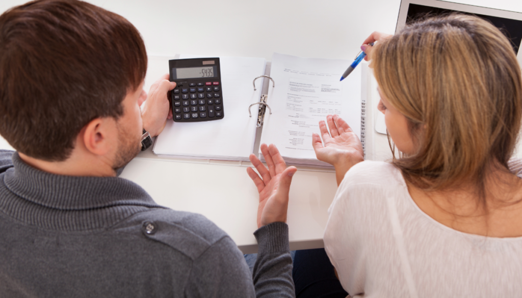 A couple discussing cmhc insurance and what their options are